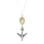 a silver airplane pendant on a chain