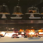 a display of desserts and candles