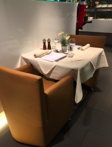 a table with a menu and glasses on it