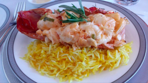 a plate of food with rice and shrimp