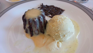 a plate of dessert with ice cream and chocolate