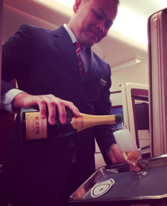 a man pouring champagne into a glass