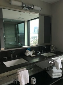 a bathroom with a large mirror and a large mirror
