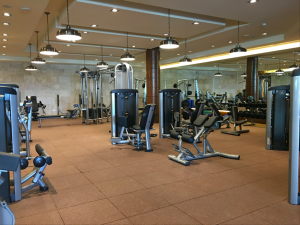 a large gym with many exercise equipment