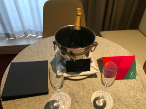 a bottle of champagne in a bucket on a table