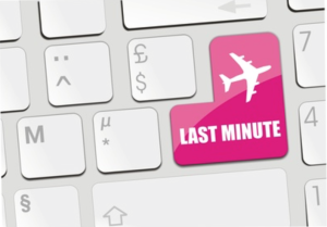 a keyboard with a pink key with a plane and a white key