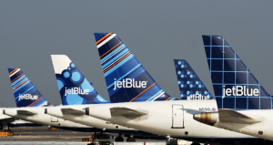 a group of airplanes parked on a runway