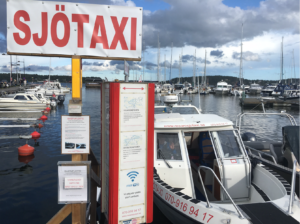 a sign next to a boat