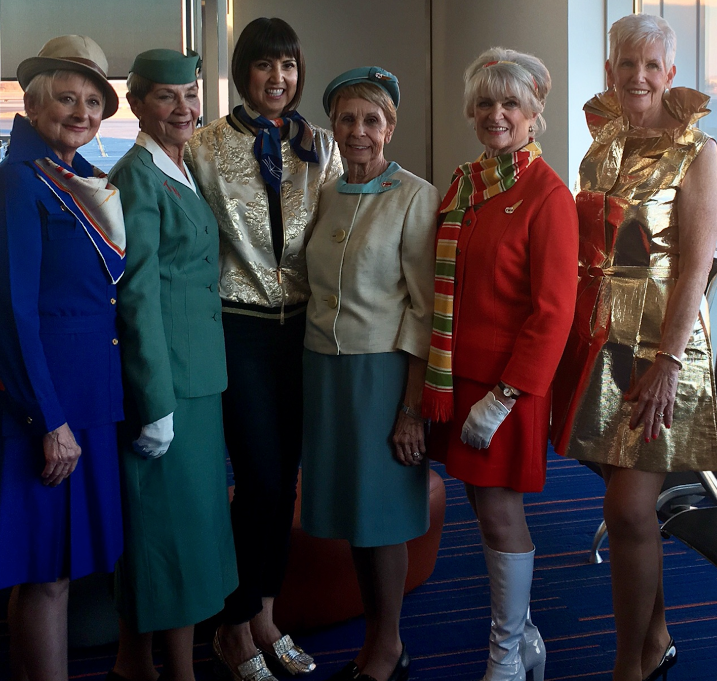 Former TWA flight attendants pose with Trina Turk after the fashion show.