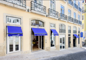 a building with blue awnings