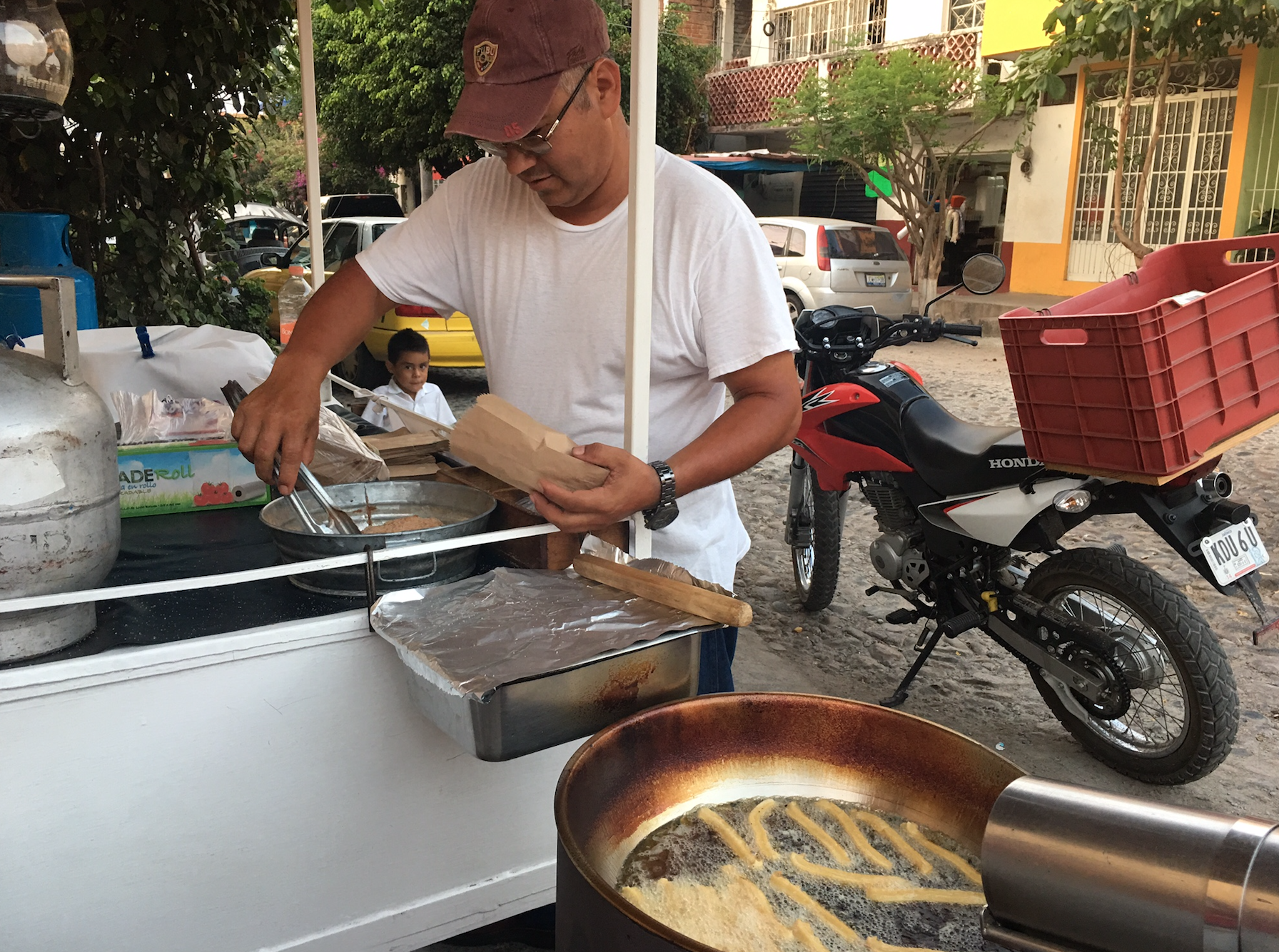 a man cooking food outside