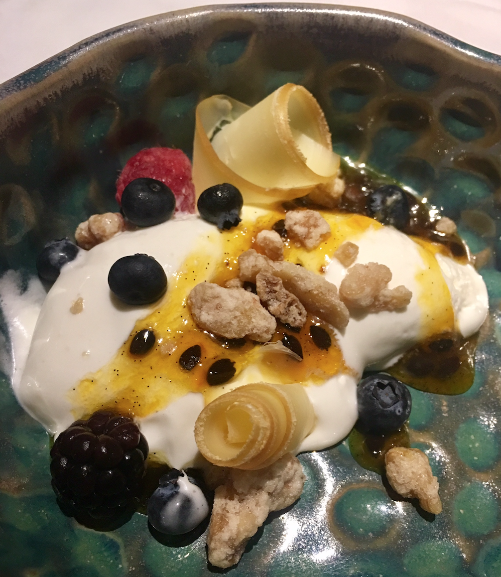 a bowl of food with fruit and yogurt