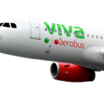 a white airplane with green and red text