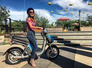 a woman on a scooter