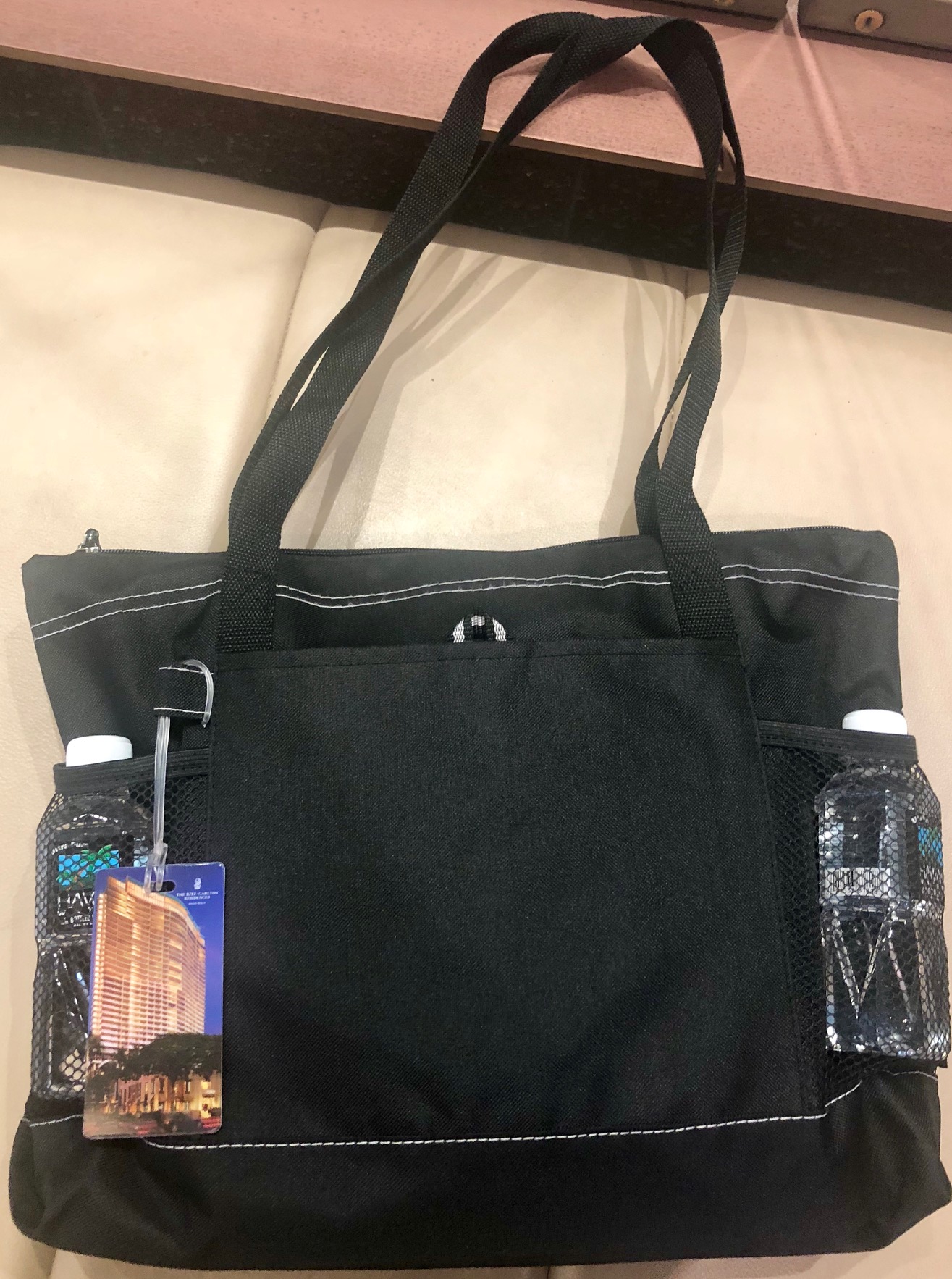 a black bag with water bottles on it
