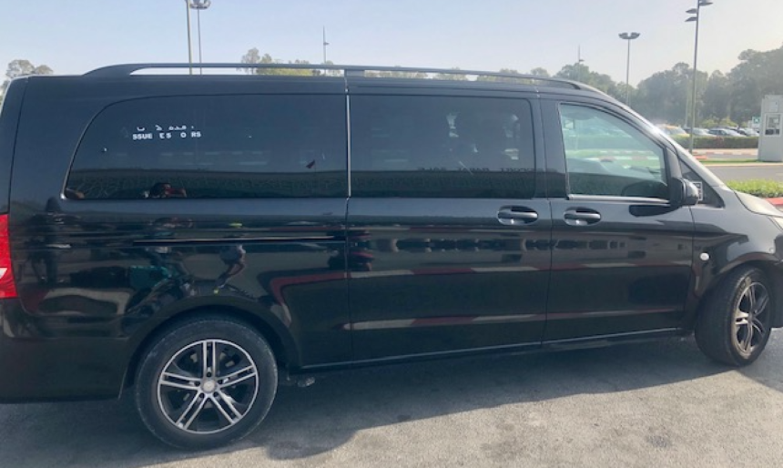a black van parked in a parking lot